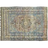 An antique rug, 300 x 460cm Fading and localised wear