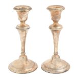 A pair of George V silver candlesticks, with reeded bands, 17.5cm h, marks rubbed, Birmingham