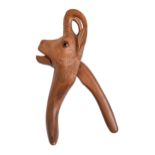 A Swiss carved walnut glass eyed deer's head lever nutcracker, second quarter 20th c, 22cm  h Good