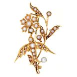 An Edwardian split pearl swallow and flower brooch, in gold, 43mm l, marked 15ct, 5.6g Good