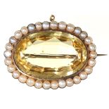 A Victorian citrine and split pearl brooch, in gold, 43mm l, 16.8g Good condition