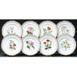 A set of eight Staffordshire bone china botanical dessert plates, c1840 with gilt border and