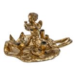 A naturalistic cast brass Putto figural taperstick of waterlily leaf design, 12cm h, indistinct PODR