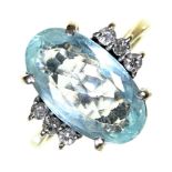 An aquamarine and diamond ring,  the oval aquamarine 9 x 16mm, flanked by lines of three diamonds,