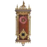 A French mahogany wall clock, c1900, with lacquered brass mounts and copper chapter ring with shield