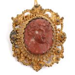 An antique jasper cameo of the head of Bacchus, 21g, mounted in a later giltmetal brooch Wear
