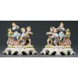 A pair of German porcelain groups of three children, late 19th c, in colours, 19cm h One or two