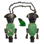 A pair of French Art Deco French Colonial inspired jade green plastic and white metal mask