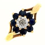 A sapphire and diamond cluster ring,  illusion set, in 9ct gold, London 1977, 2g, size N Good
