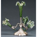 A Victorian EPNS flower stand, the four wrythen fluted green glass trumpet vases with white rim,
