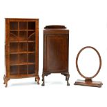 A bow fronted mahogany pillar cabinet, on claw and ball feet, 112cm h; 40 x 49cm, a 19th c oval