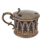 A Victorian gothic silver mustard pot, the sides pierced with arches and water leaves, crested, blue