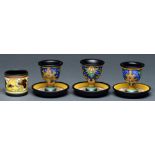 A set of three Gouda art pottery eggcups and a salt cellar, second quarter 20th c, eggcup 70mm h,