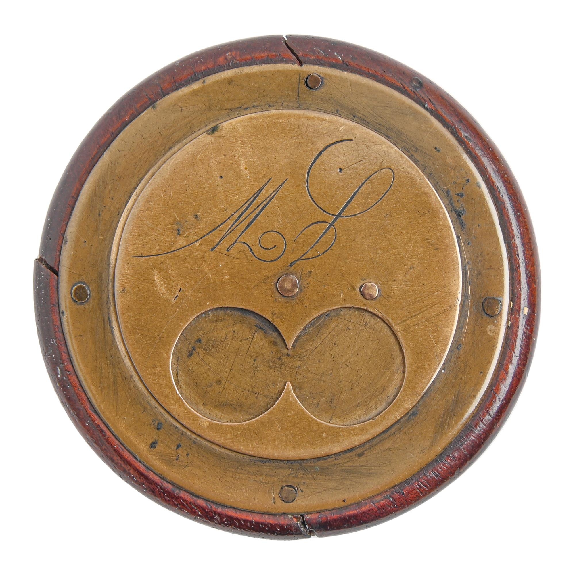A Victorian round brass faced and backed two finger snuff box,  engraved with initials, the back
