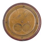 A Victorian round brass faced and backed two finger snuff box,  engraved with initials, the back