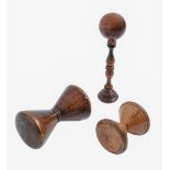 A Victorian turned lignum vitae cup and ball toy and two reels, cup 16cm h (4) Ball cracked