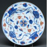 A Chinese Imari plate, 18th c, painted with peony meander in brown edged rim, 22.5cm diam Light wear