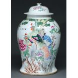 A Chinese famille rose  jar and cover, 20th c, enamelled with a peacock and other birds amidst