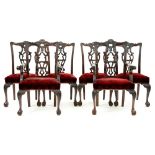 A set of six carved mahogany dining chairs, c1930, in George II style, on cabriole legs and claw and