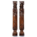 A pair of 'carved oak' resin medieval figural wall sconces, 20th c, 49cm h Good condition