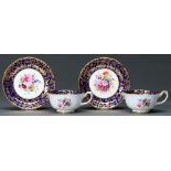 A pair of Hammersley  & Co cobalt ground teacups and saucers, second quarter 20th c, decorated