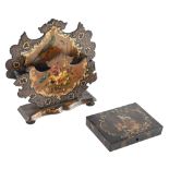 A Victorian papier mache letter rack, of cartouche form painted with a bird on a branch and