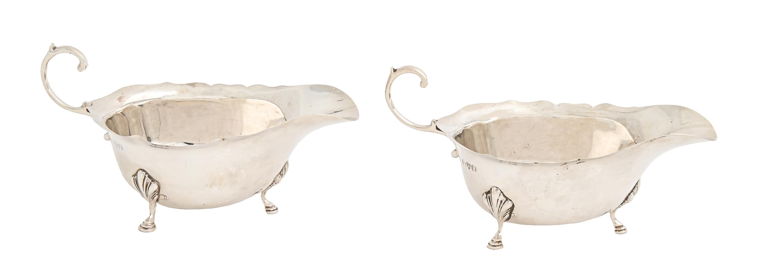 A pair of George VI silver sauceboats, with flying scroll handle, 15.5cm l, by Adie Brothers Ltd,