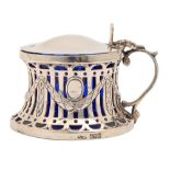 An Irish Edwardian pierced SILVER mustard pot in the form of a dish ring, blue glass liner, 55mm