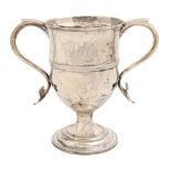 A George II silver cup, with reeded girdle and scroll handles, crested, loaded, 15.5cm h, by