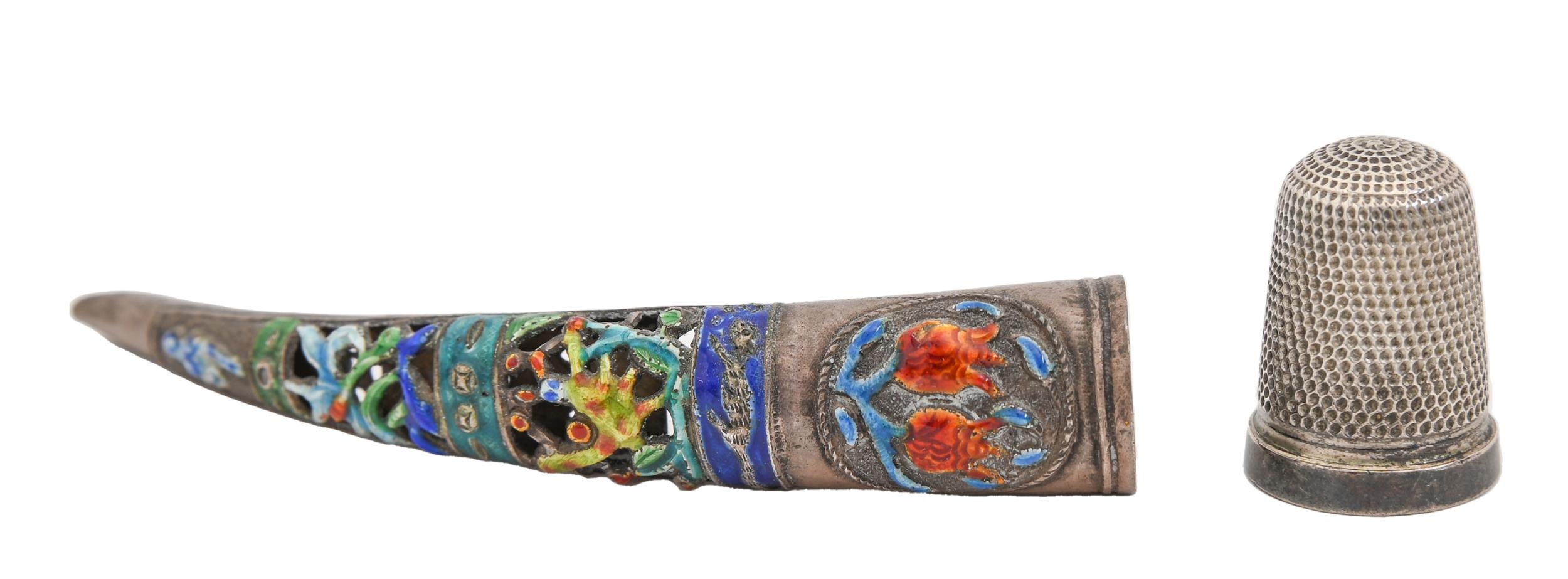 A Chinese silver and enamel finger guard, 19th c, 86mm l, 4.5dwts, a Victorian leather covered