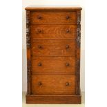 A Victorian oak wellington chest, William Whiteley Westbourne Grove London, fitted with seven