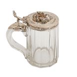 A German silver mounted glass tankard, c1869, the lid applied with deer's head finial amidst