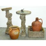 A reconstituted stone child figural birdbath, 78cm h and other garden ornaments, etc