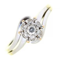 A seven stone diamond cluster ring, in 18ct white gold, 3.5g, size J