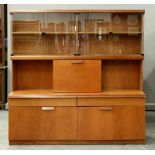 A teak drinks cabinet, late 1970's, with plate glass doors to the upper part, 183cm h; 48 x 183cm