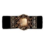 A Victorian black velvet mourning bracelet, with rock crystal, gold and enamel locket clasp, 14.