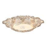 A Victorian silver dish, engraved with initial R, the sides pierced with trellis and die stamped