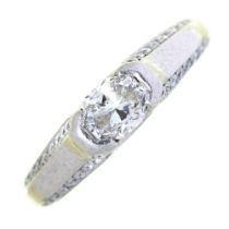 A diamond ring, the octagonal diamond set in platinum, the sides outlined with diamond accents, 6.
