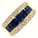 A sapphire and diamond cocktail ring,  with a double line of calibre cut sapphires between rows of