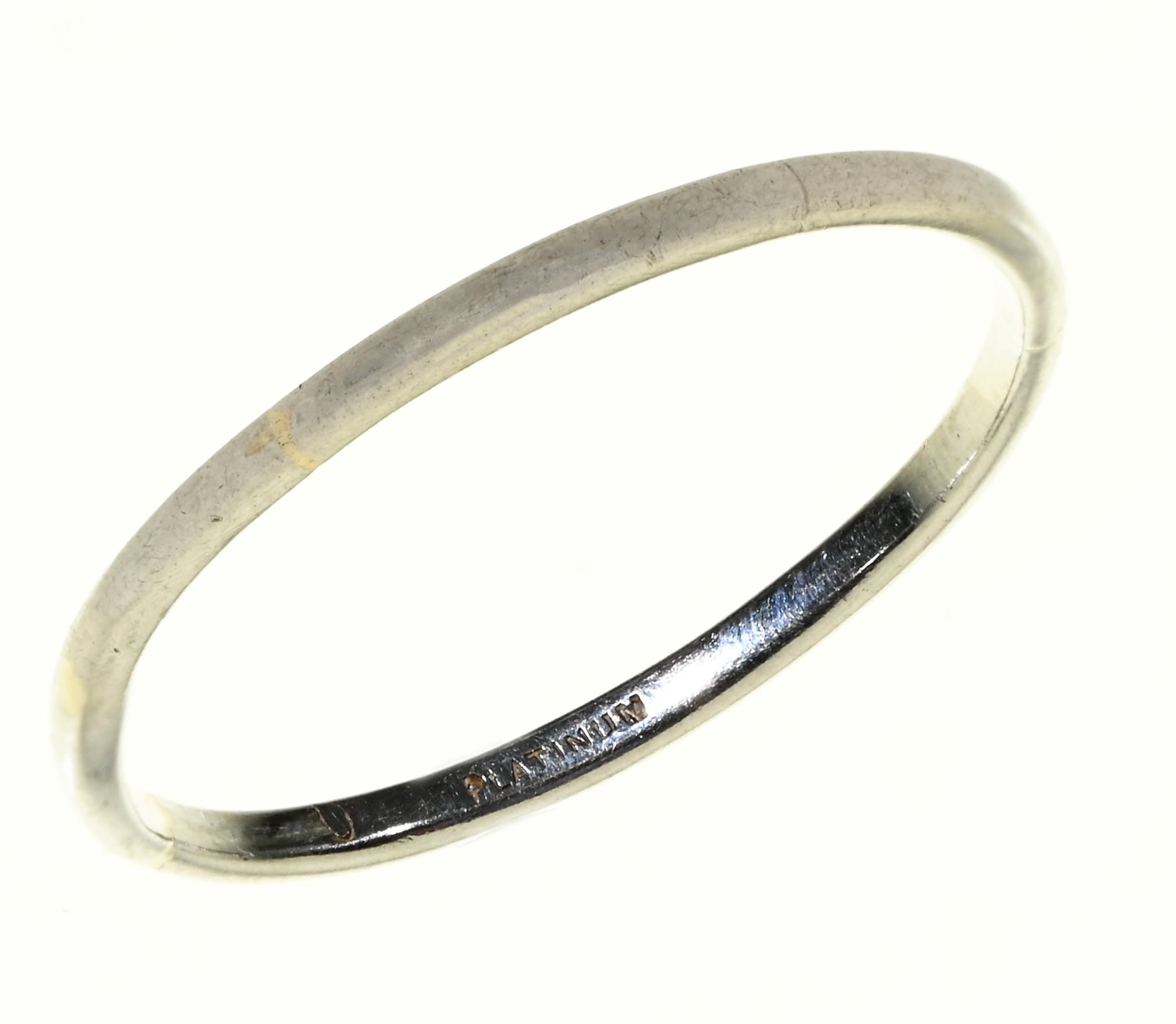 A platinum wedding ring, marked PLATINUM, 3.7g, size 3 Worn