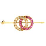 A ruby and diamond linked circles brooch, on associated gold knife wire, 45mm l, marked 9ct, 5.6g