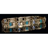 Liberty & Co. A gold, moonstone and translucent enamel bracelet, designed by Archibald Knox,