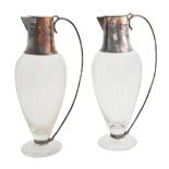 A pair of Elizabeth II silver mounted glass claret jugs, 30cm h, by Hugh Johnson, Birmingham 1996,