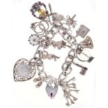 A silver charm bracelet and padlock, approximately 20cm l, 65.7g Good condition