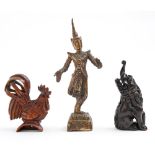 A Japanese boxwood okimono of a cockerel, 55mm h and two other South East Asian works of art (3)