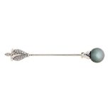 A diamond and black cultured pearl pin, with larger navette diamond, in white gold coloured metal,