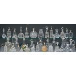 A collection of silver mounted and other cut glass scent bottles, late 19th - early 20th c,
