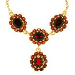 A garnet necklace, possibly Polish, 20th c, in gold with garnet drop, 45cm l, indistinct control