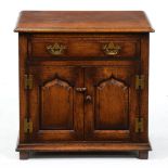 A Titchmarsh & Goodwin oak dwarf chest, fitted with a drawer above pair of ogee raised and fielded