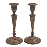 A pair of George V silver candlesticks, in neo classical style, nozzles, 23cm h, by Elkington & Co